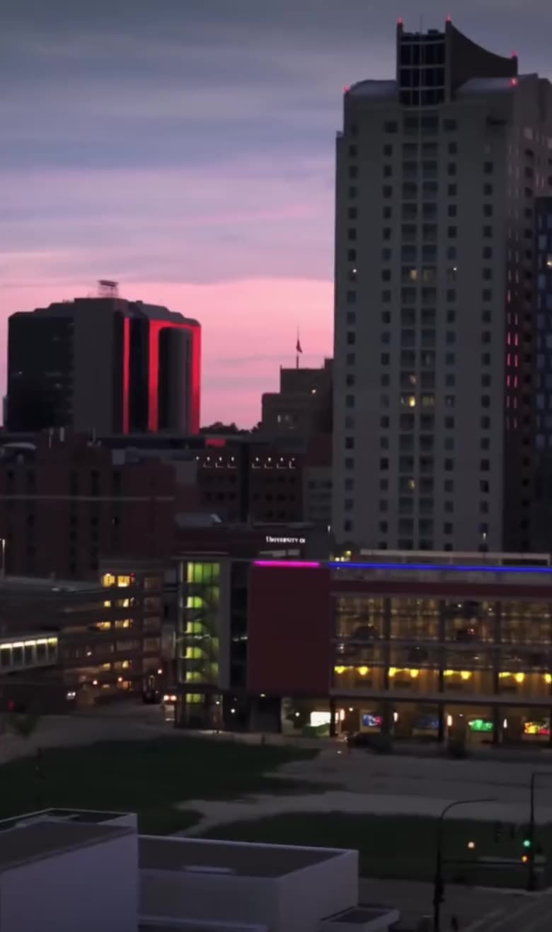 Downtown Rochester at dusk, with the Plummer Building against a pink sky