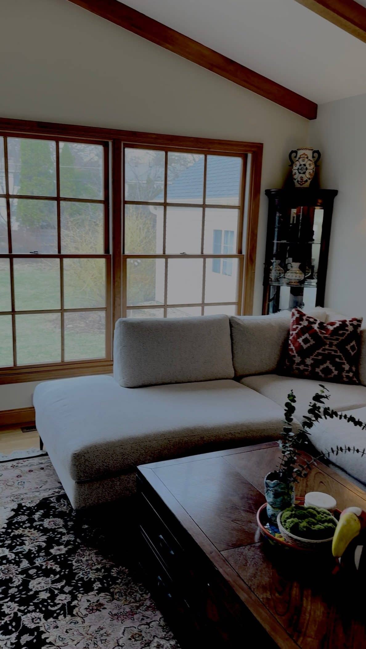The same living room in a dim, tilted phone snapshot